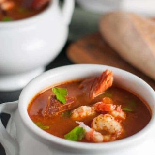 Simple Cioppino that anyone can make. Cioppino is a fabulous fish stew that originated in San Francisco and it featured in top restaurants. Here is a simple way to make it at home, using whatever seafood is available where you live. Restaurant quality food from your own kitchen!