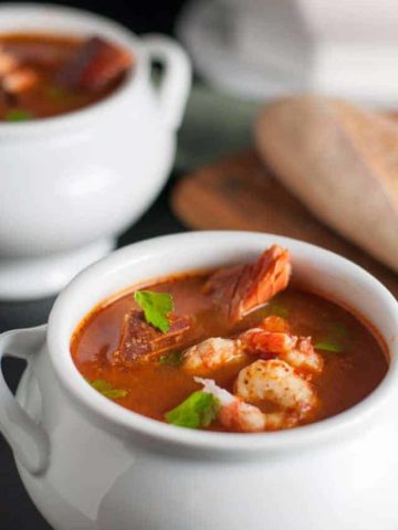 Simple Cioppino that anyone can make. Cioppino is a fabulous fish stew that originated in San Francisco and it featured in top restaurants. Here is a simple way to make it at home, using whatever seafood is available where you live. Restaurant quality food from your own kitchen!