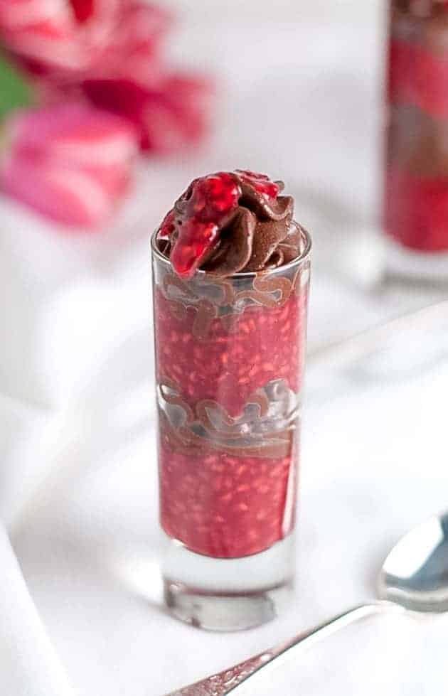 Here's a cute and easy Paleo shot glass dessert. Whipped chocolate coconut cream with raspberry-orange sauce makes a decadent and delicious dessert! |www.flavourandsavour.com