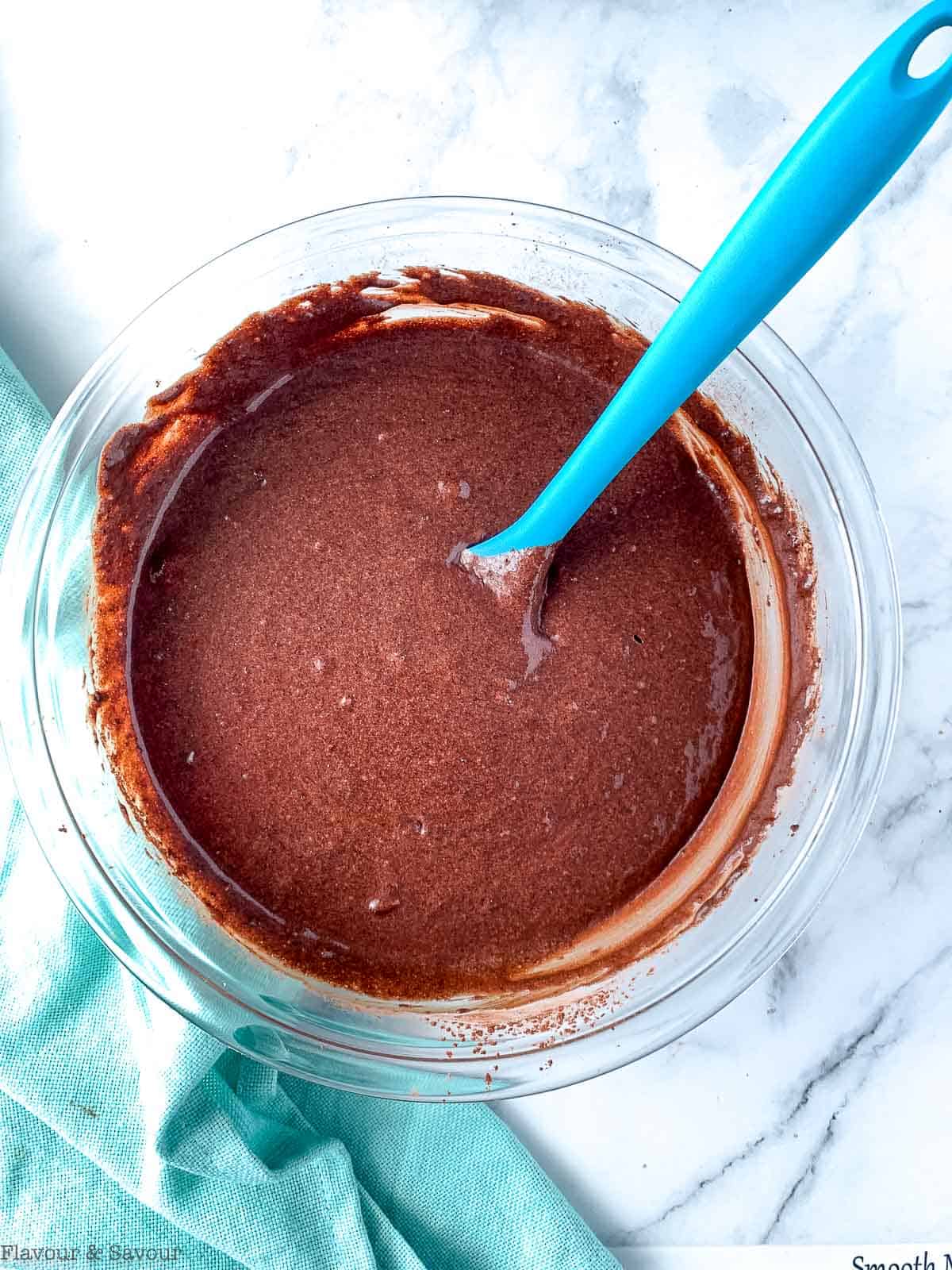 Combining wet and dry ingredients for chocolate quinoa cupcakes.