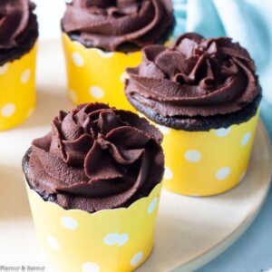 quinoa chocolate cupcakes in yellow cupcake cases.