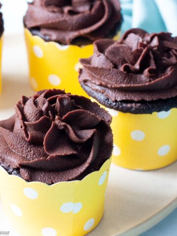 quinoa chocolate cupcakes in yellow cupcake cases.