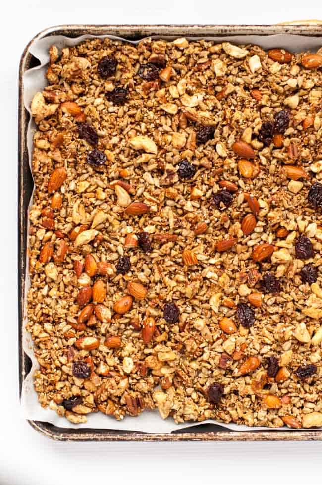 Dried cherry granola on a baking sheet.