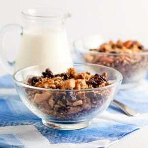 Two bowls of granola on a blue cloth