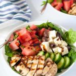 Skinny Greek Chicken Bowl with Watermelon and Feta, drizzled with a balsamic reduction. Succulent chicken marinated with lemon and herbs, sweet watermelon, feta cheese and Kalamata olives all drizzled with balsamic reduction.