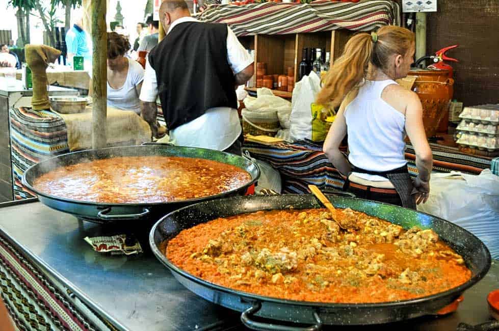 Two large paella pans with paella in Ronda Spain
