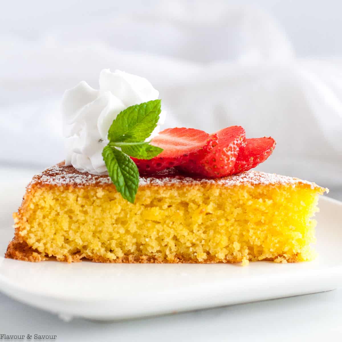 Flourless almond cake with sliced strawberries.