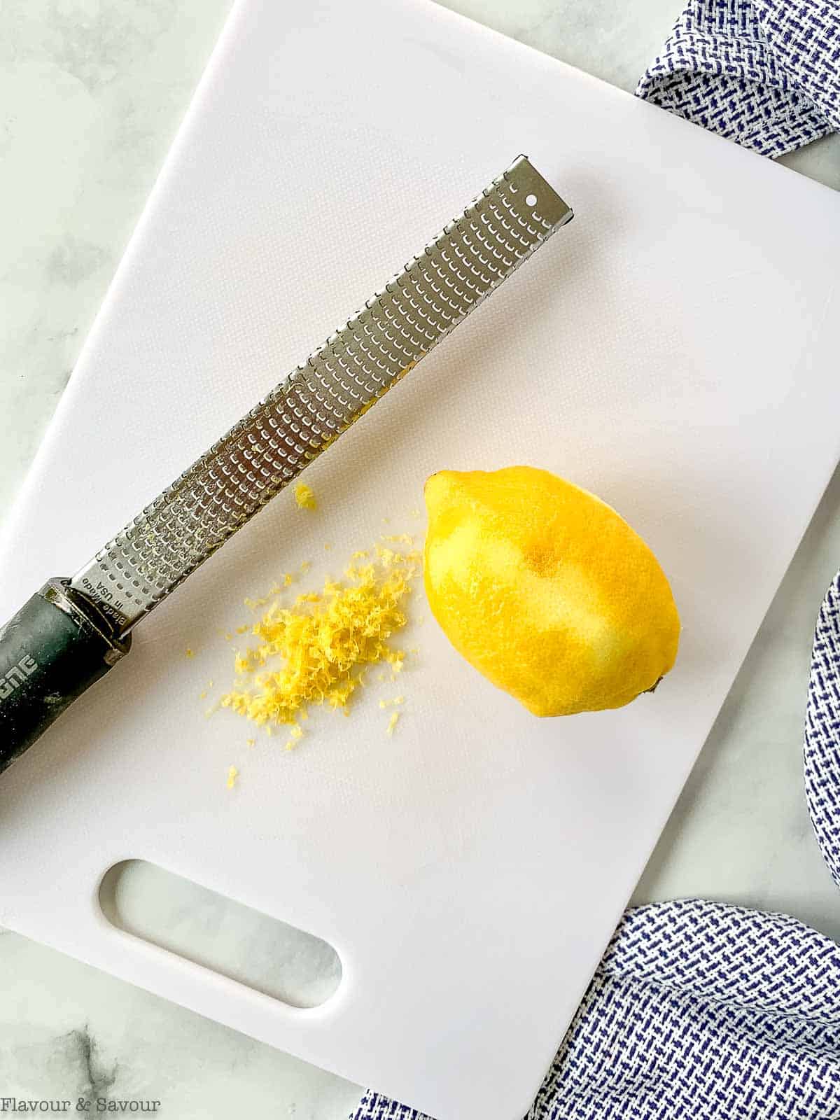 Zesting a lemon with a microplane.