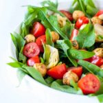 Balsamic Bocconcini Cherry Tomato Salad with Marinated Artichokes and Arugula. This vegetarian salad packs a punch of flavour. Peppery arugula , balsamic bocconcini balls , marinated artichokes and fresh cherry tomatoes combine to make a salad I could eat every day! |www.flavourandsavour.com