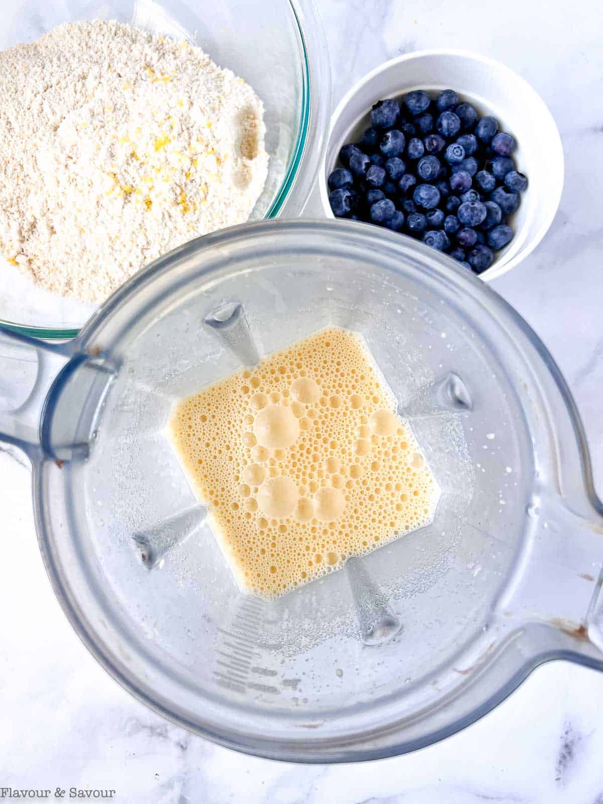 Wet ingredients and dry ingredients for gluten-free blueberry buckle.