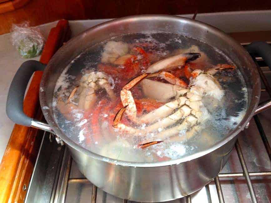 Crab legs in boiling water.