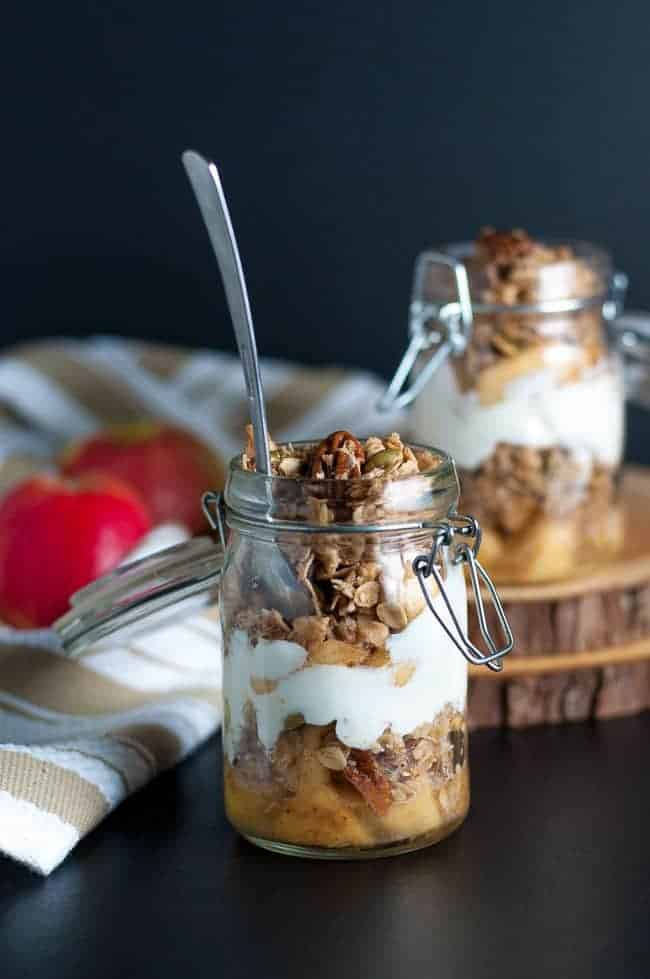 Gluten-Free Apple Crumble Breakfast Parfait in a hinged jar with layers of apples, granola and yogurt
