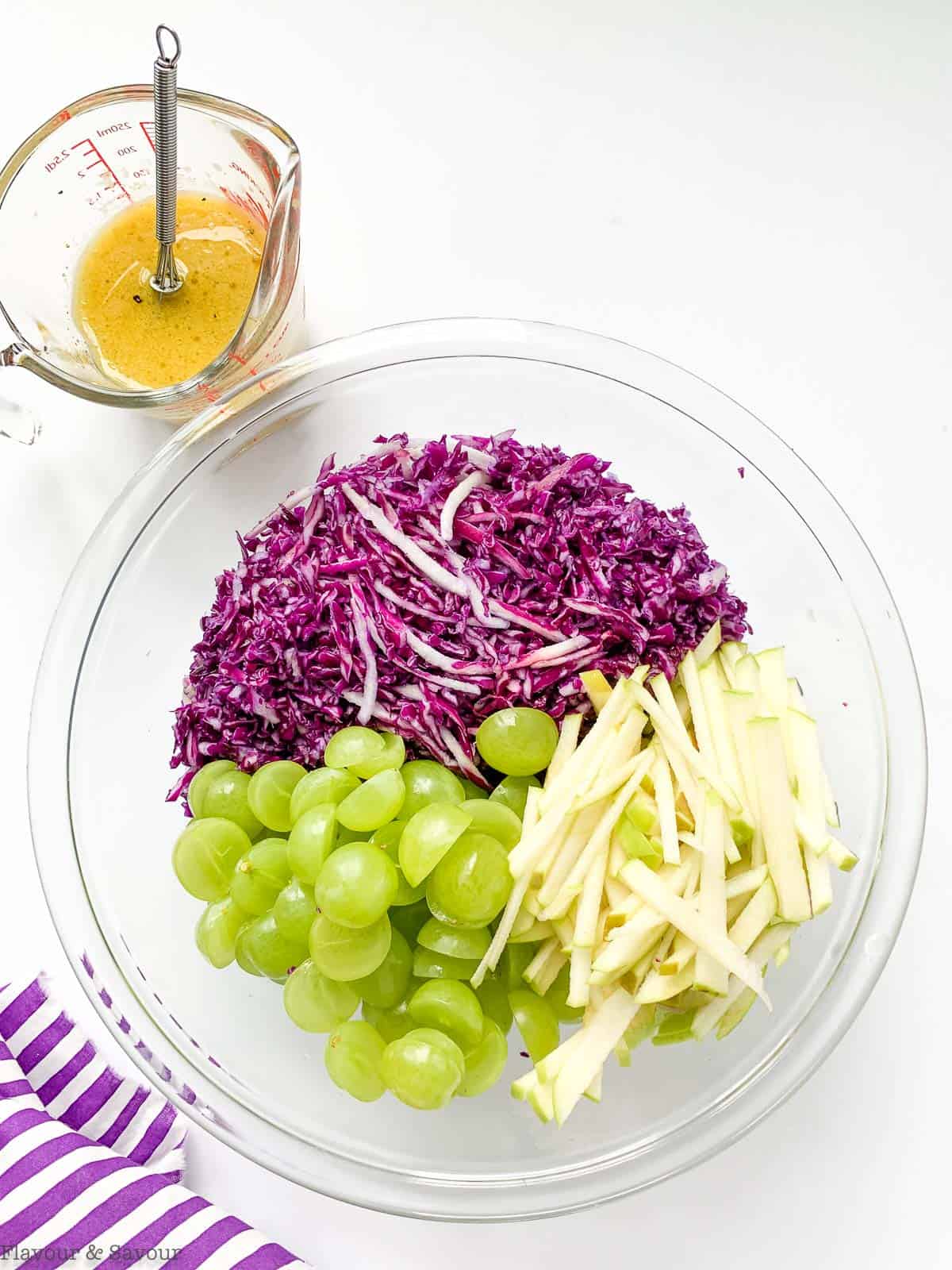 Ingredients for Red Cabbage Slaw in a bowl.