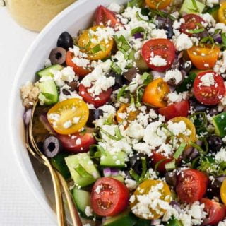 Mediterranean Quinoa Salad with a pitcher of Lemon Herb Dressing