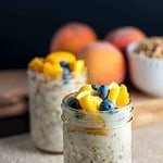 Peach and Blueberry Overnight Oats in two small jars..