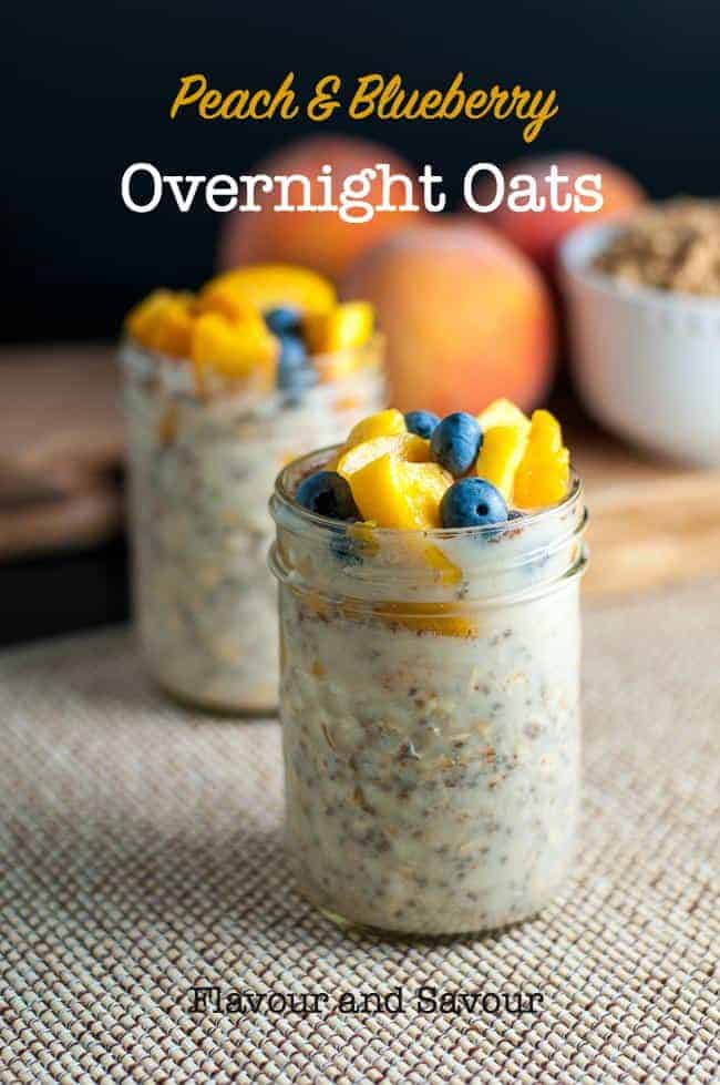 Two jars of overnight oats with peaches and blueberries on top.