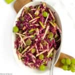 Overhead view of Grape Apple and Red Cabbage Slaw in an oval bowl