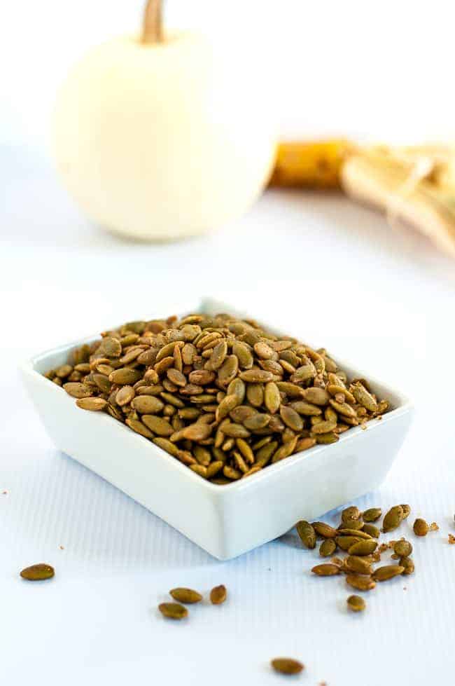 Spiced Pumpkin Seeds make a healthy snack, an addition to a cheese platter, or a garnish for soup or salad. They're mildly salty with a kick from chipotle peppers! |www.flavourandsavour.com