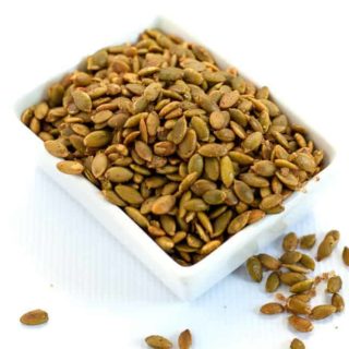 Spiced Pumpkin Seeds make a healthy snack, an addition to a cheese platter, or as a garnish for soup or salad. They're mildly salty with a kick from chipotle peppers! |www.flavourandsavour.com