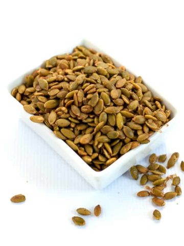 Spiced Pumpkin Seeds make a healthy snack, an addition to a cheese platter, or as a garnish for soup or salad. They're mildly salty with a kick from chipotle peppers! |www.flavourandsavour.com