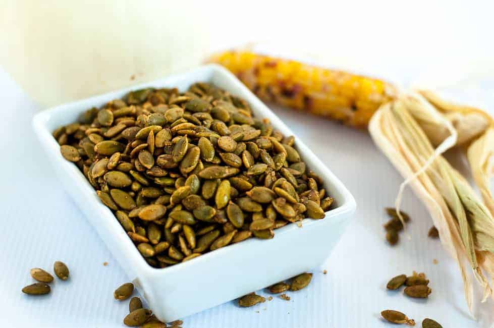 Spiced Pumpkin Seeds make a healthy snack, an addition to a cheese platter, or a garnish for soup or salad. They're mildly salty with a kick from chipotle peppers! |www.flavourandsavour.com