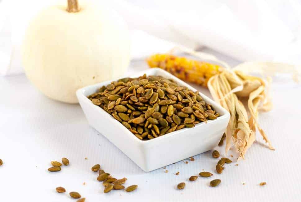 Spiced Pumpkin Seeds make a healthy snack, an addition to a cheese platter, or a garnish for soup or salad. They're mildly salty with a kick from chipotle peppers!|www.flavouradnsavour.com