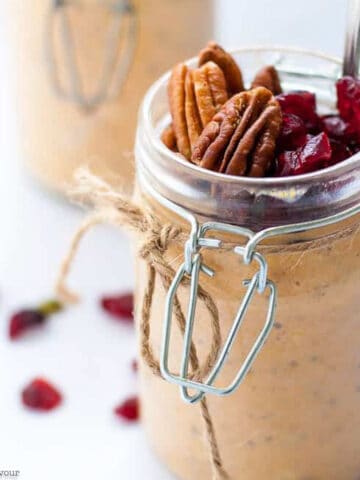 Pumpkin pie overnight oats in a jar tied with jute.