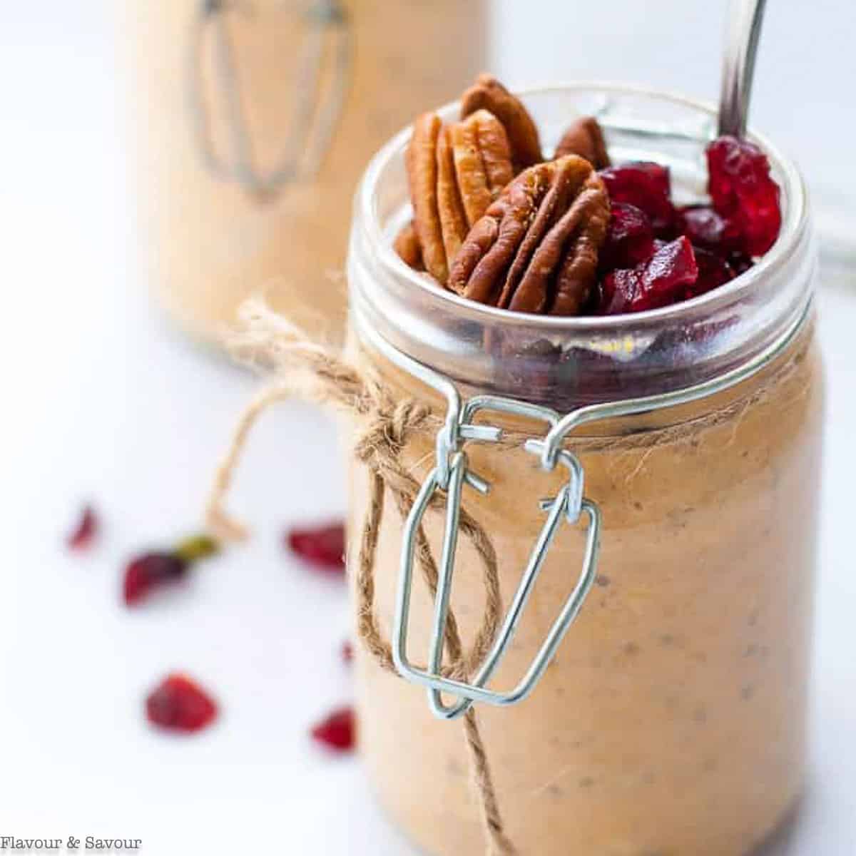 Pumpkin pie overnight oats in a jar tied with jute.