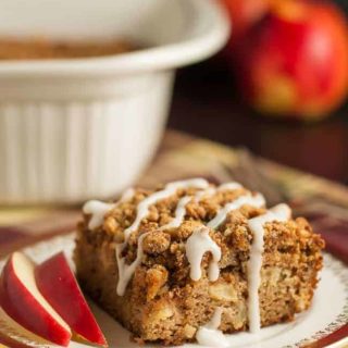 Gluten-Free Apple Cinnamon Coffee Cake drizzle with frosting and served with apple slices
