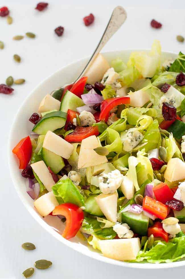 Pear and Cranberry Chopped Salad. Crisp pears and crunchy vegetables with sweet cranberries and tangy blue cheese make this colourful fall salad. A family favourite, perfect for potlucks. |www.flavourandsavour.com