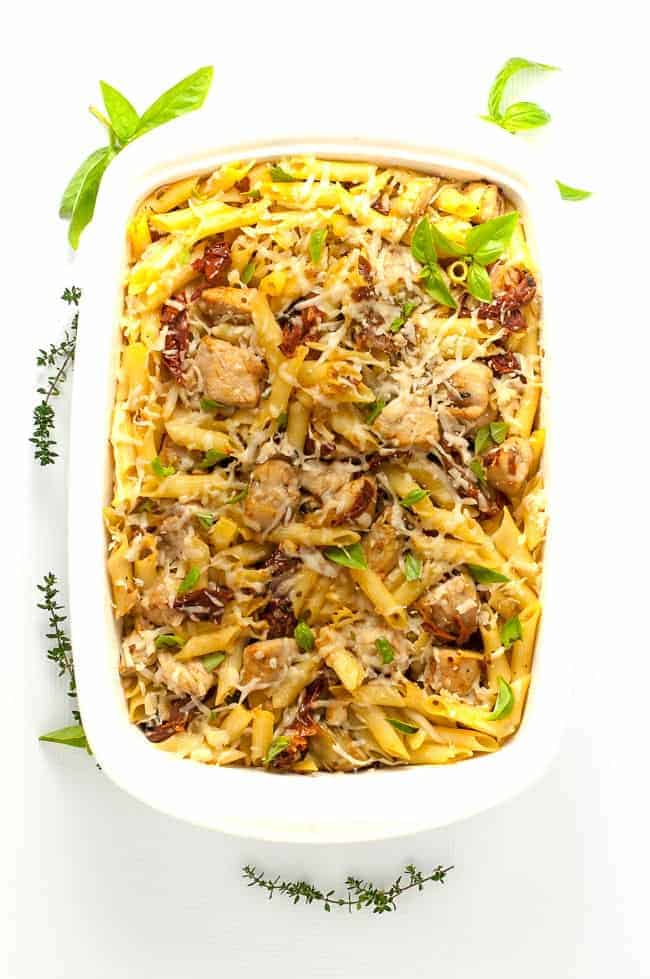 Overhead view of a 9 x 13 casserole dish with Sun dried Tomato Artichoke Chicken Penne Pasta.