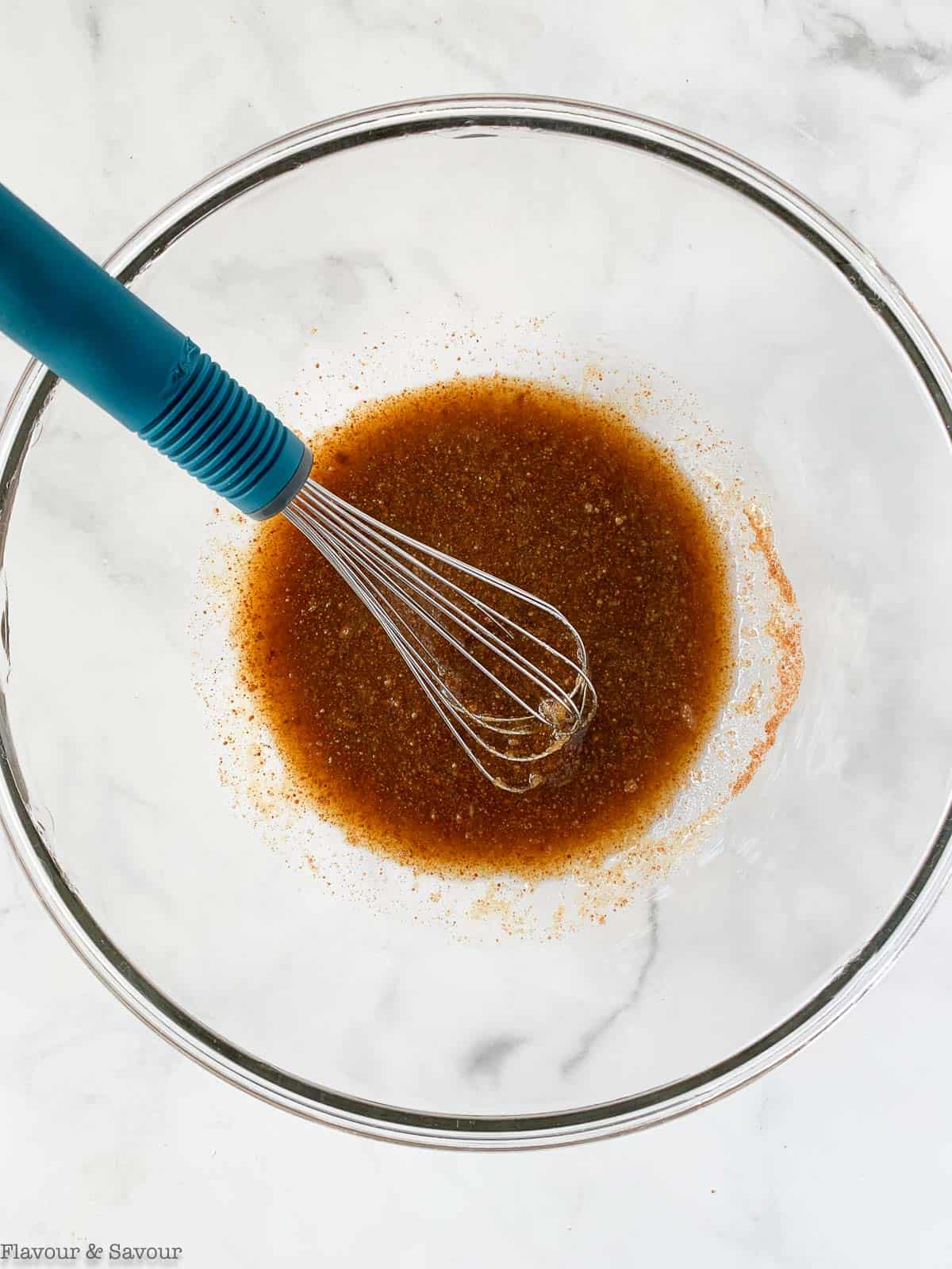 Wet ingredients for apple coffee cake in a bowl.