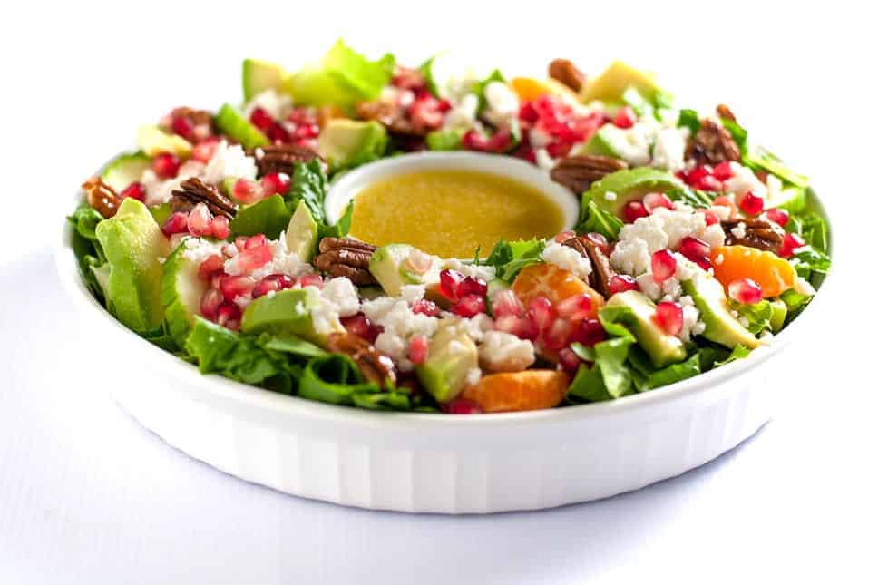 This Pomegranate Mandarin Salad with Avocado and Feta is a festive salad for any winter meal! It's bursting with fruit rich in Vitamin C, crunchy pecans and creamy avocado, and topped with crumbled feta or goat cheese. Serve it as a holiday wreath salad! One of 6 Tasty Healthy Winter Salads from Flavour and Savour