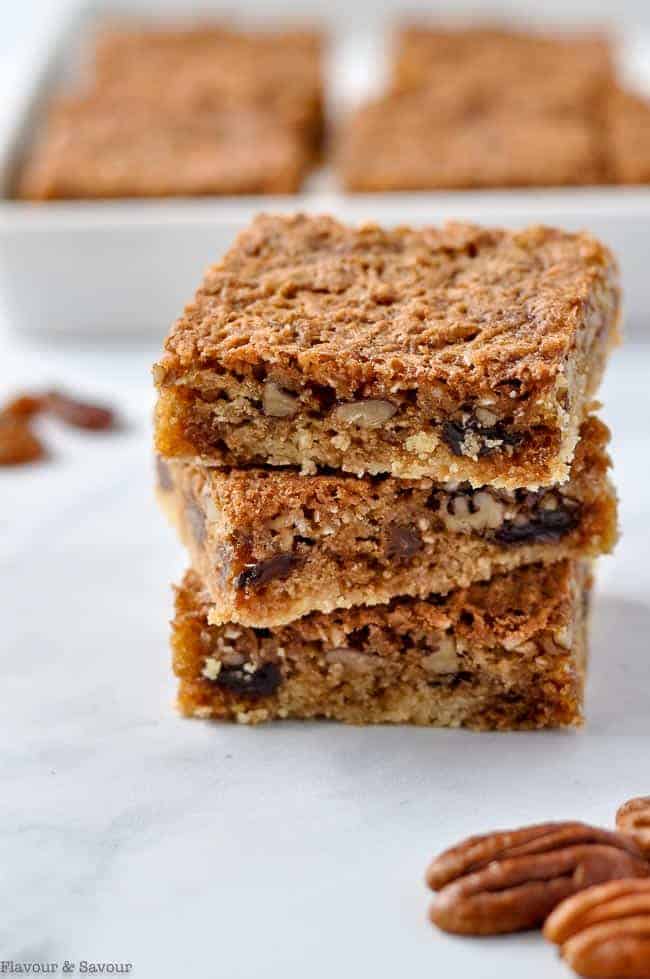 Close up view of butter tart squares stacked