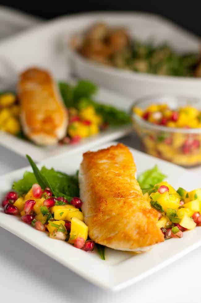 Salt and Pepper Crusted Halibut with Mango Pomegranate Salsa. Here's a quick way to sear halibut and guarantee it stays moist. This is an easy weeknight meal that's spectacular enough for entertaining! Serve with a colourful salsa. |www.flavourandsavour.com
