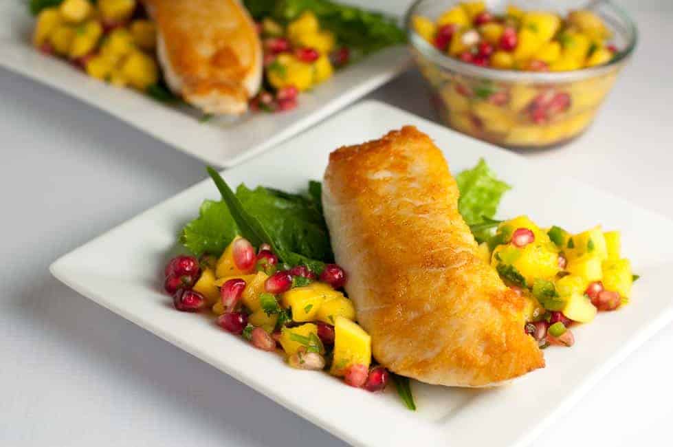 Salt and Pepper Crusted Halibut with Mango Pomegranate Salsa. Here's a quick way to sear halibut and guarantee it stays moist. This is an easy weeknight meal that's spectacular enough for entertaining! Serve with a colourful salsa. |www.flavourandsavour.com