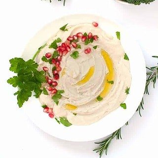 Creamy Lemon Feta Dip garnished with pomegranates.