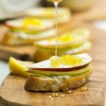 Drizzling honey on Blue Cheese and Pear Crostini