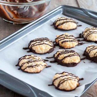 These gluten-free Chocolate Dipped Crispy Coconut Cookies are coated and drizzled with a thin layer of dark chocolate. Make ahead and freeze for unexpected company. |www.flavourandsavour.comT