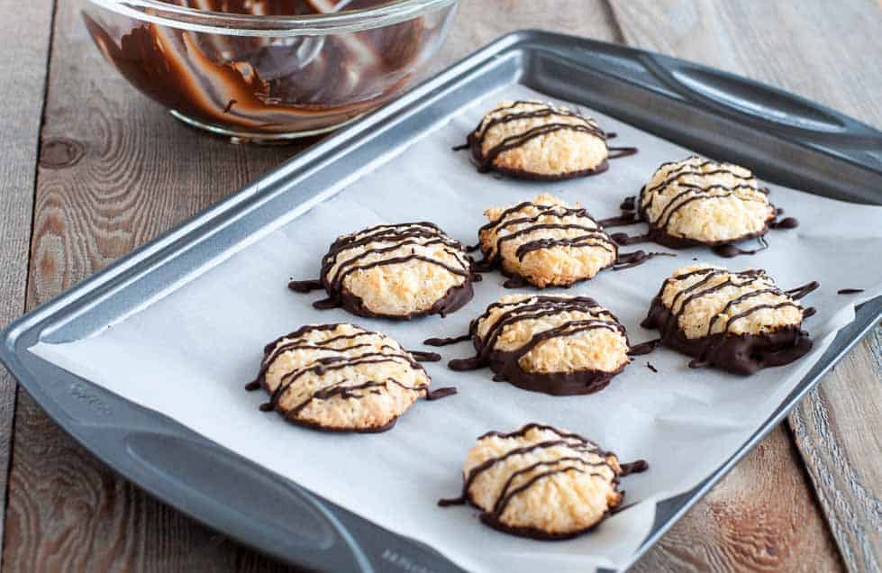 These gluten-free Chocolate Dipped Crispy Coconut Cookies are coated and drizzled with a thin layer of dark chocolate. Make ahead and freeze for unexpected company. |www.flavourandsavour.com