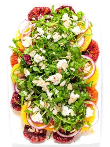 Winter Citrus Salad with Arugula and Goat Cheese. Sweet oranges, fresh mint and spicy arugula topped with tangy cheese and flaked almonds make a beautiful winter salad. |www.flavourandsavour.com