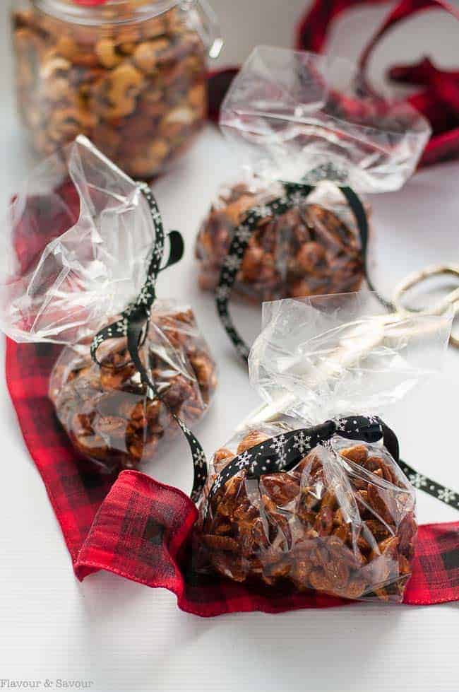 Espresso Glazed Holiday Nut Mix packaged in cellophane bags with ribbon for gifts