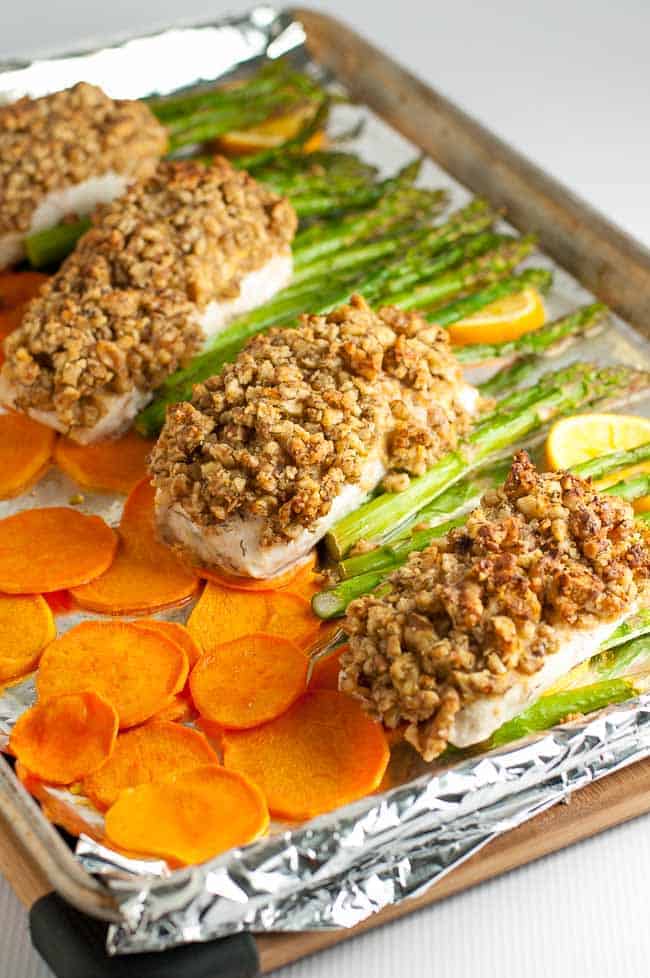 Maple Walnut Crusted Sheet Pan Halibut with crispy sweet potato chips and asparagus. 