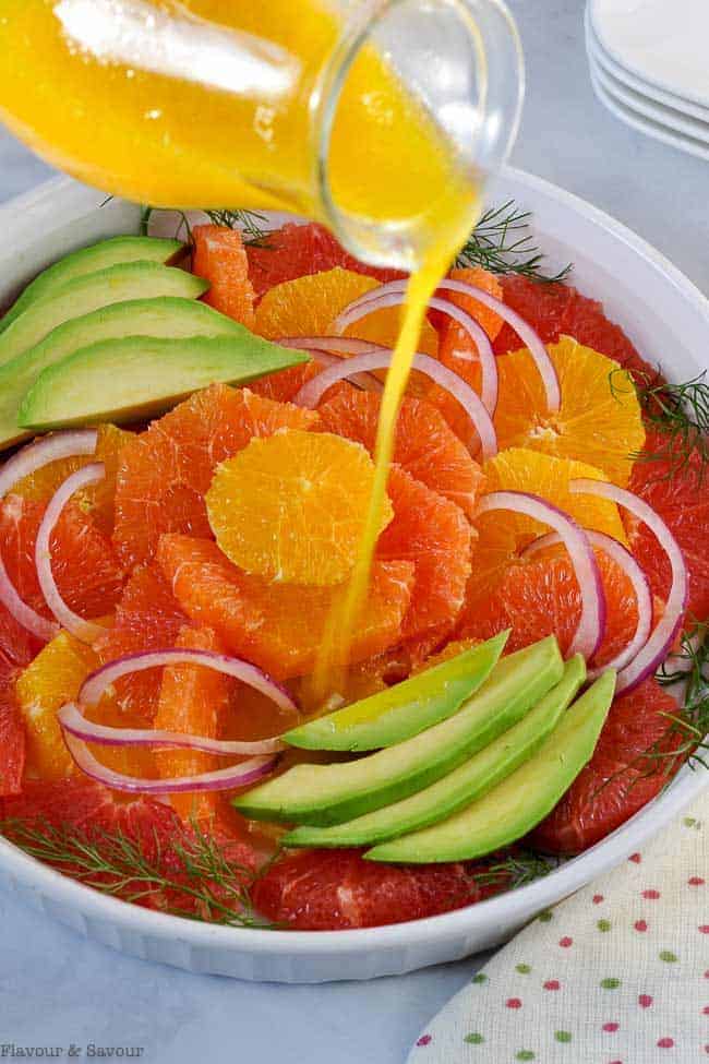 Pouring dressing on Winter Citrus Salad