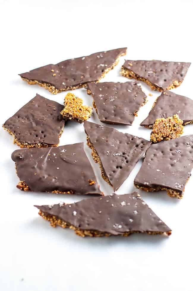 broken pieces of Healthy Quinoa Chocolate Bark made with quinoa, chia, hemp, and pepitas