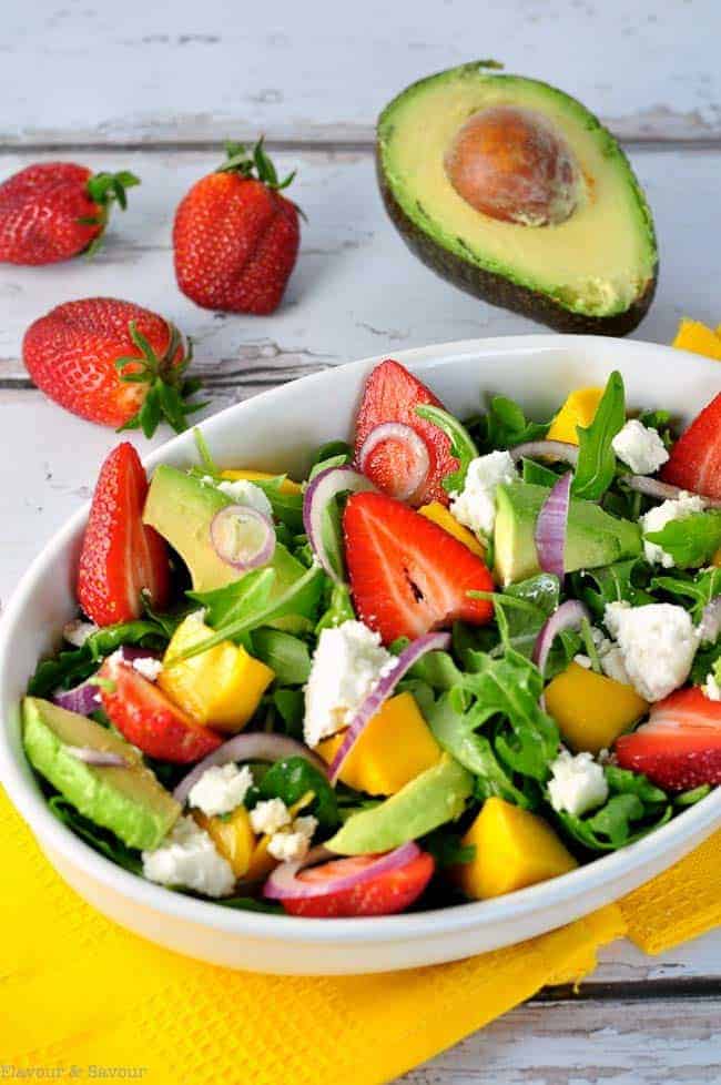 This Strawberry-Mango Arugula Salad with Goat Cheese combines fresh sweet strawberries, mango, spicy arugula, creamy avocado and goat cheese and is drizzled with a flavourful citrus vinaigrette. A beautiful spring salad.
