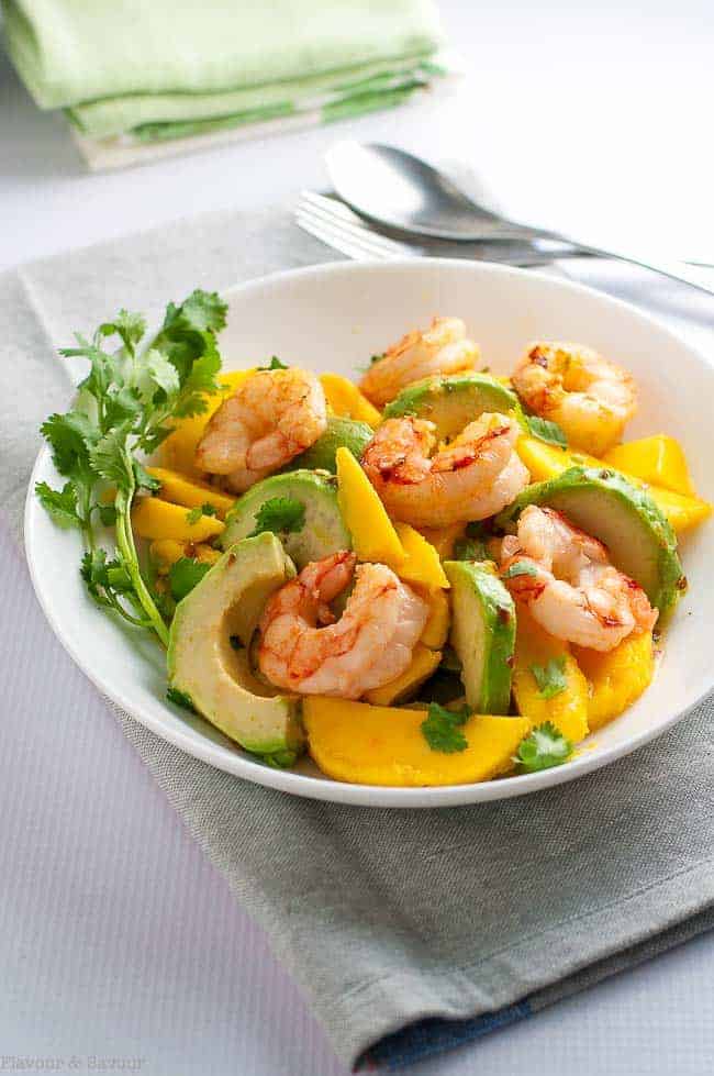 This fresh Prawn Mango Avocado Salad with sizzling shrimp can be on your dinner table in fifteen minutes. Sweet, juicy mangos, creamy avocado and tender shrimp all tossed with a lemon-lime dressing make a simple but simply delectable spring salad.