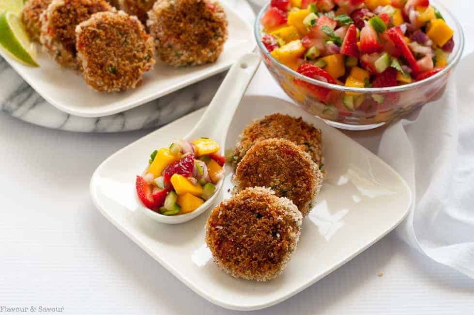 Tex-Mex Crab Cakes with Strawberry Mango Salsa with a bowl of mango salsa in the background