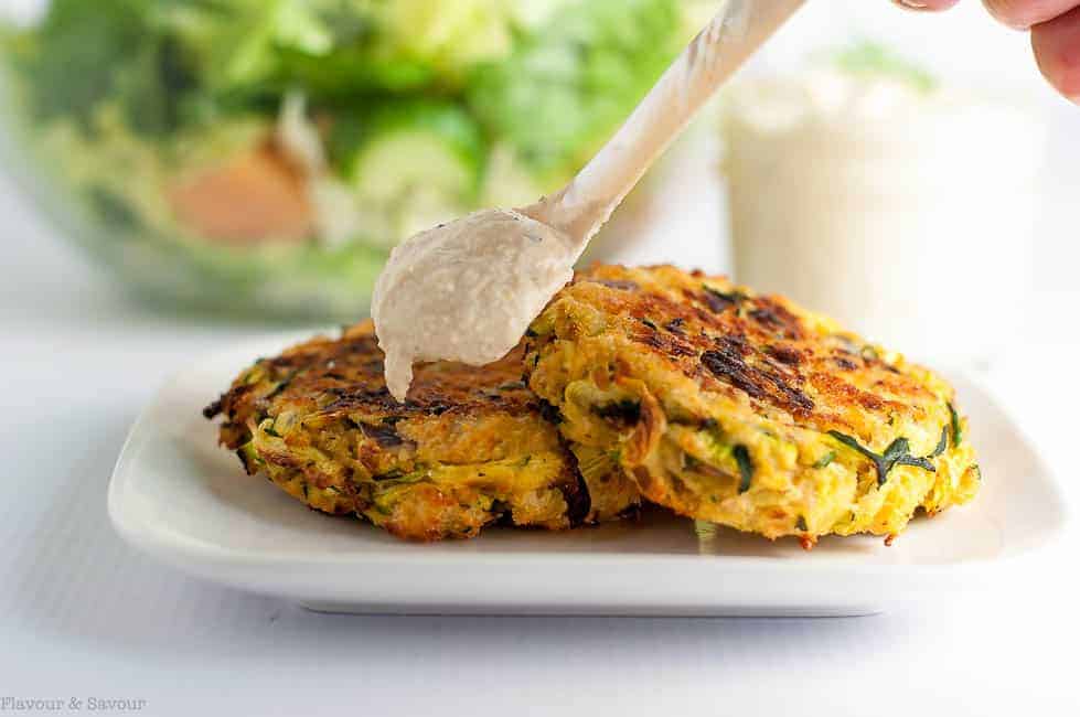 Crispy Baked Zucchini Patties with a spoonful of lemon tahini dip