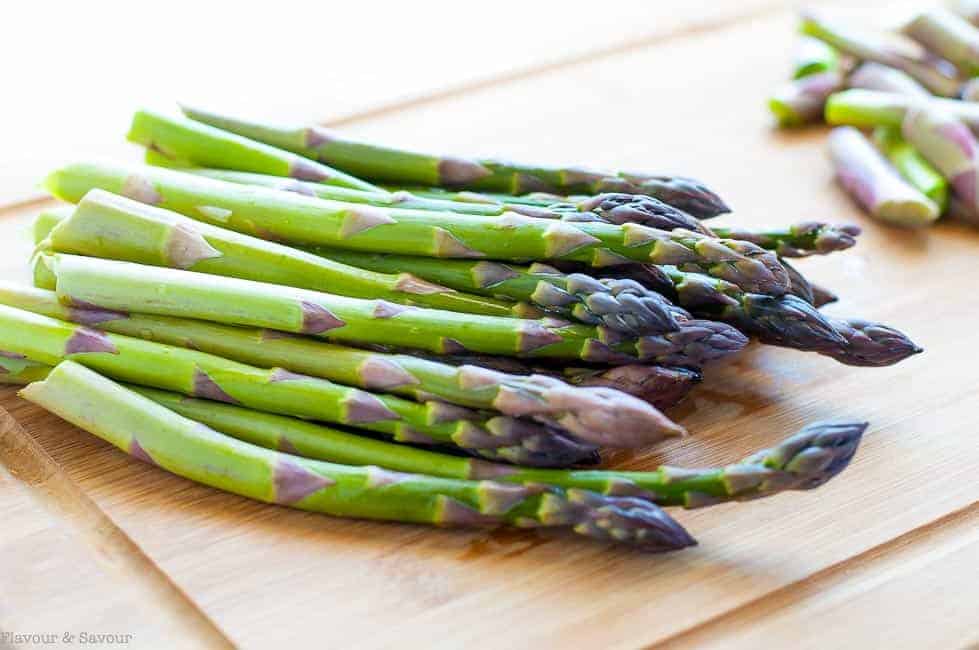 asparagus spears on a cutting board.